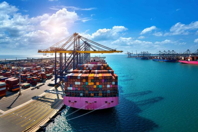 An airplane and cargo ship representing air and ocean freight